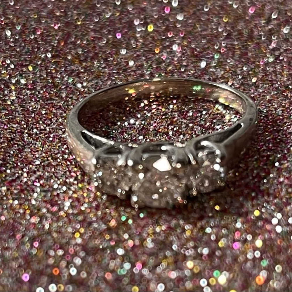 14k white gold, 3 stone diamond ring. 1 carat total.